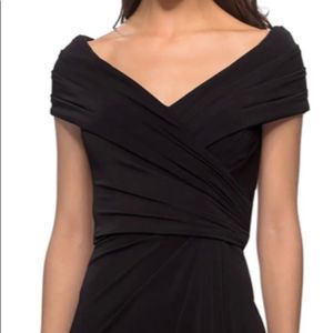 La Femme gown with portrait neckline in a flattering jersey material.